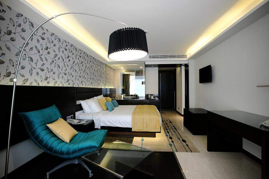 Artistic Bedroom With Blue Lounge Chairs by R. Gautam Jain Bedroom Contemporary | Interior Design Photos & Ideas