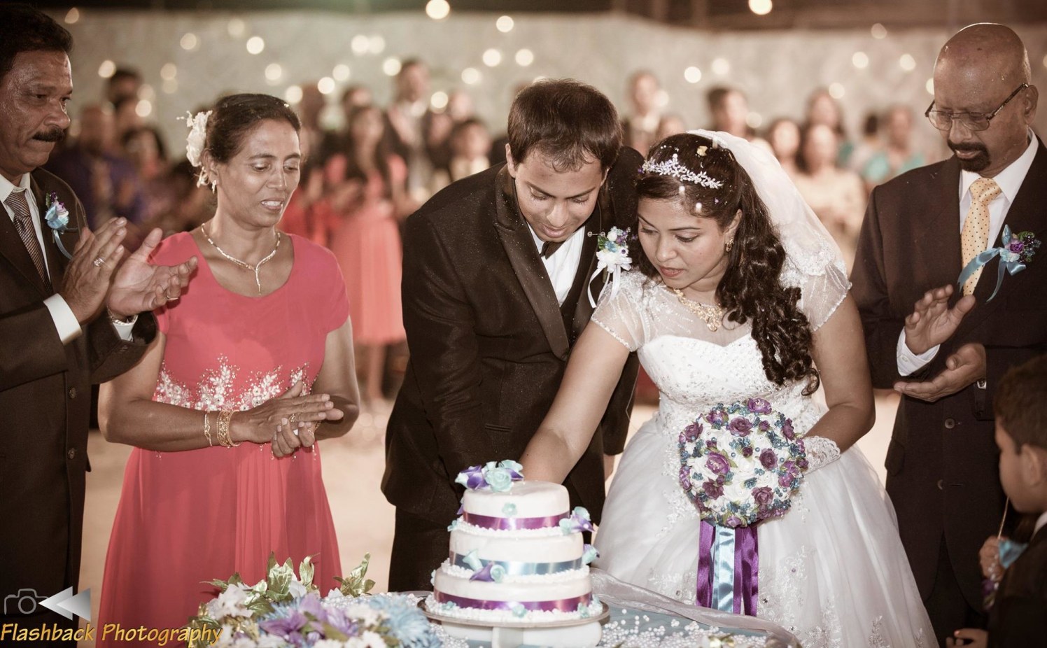 Bride and Groom Cutting Their Wedding Day Cake by Lloyd Bangera Wedding-photography | Weddings Photos & Ideas