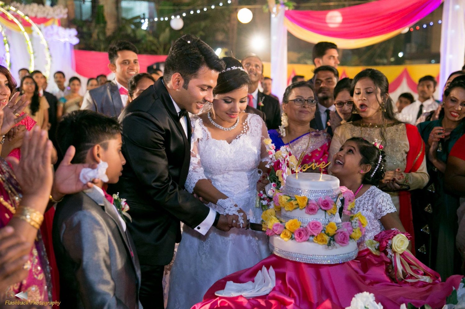 Bride and Groom Cutting Their Wedding Cake by Lloyd Bangera Wedding-photography | Weddings Photos & Ideas
