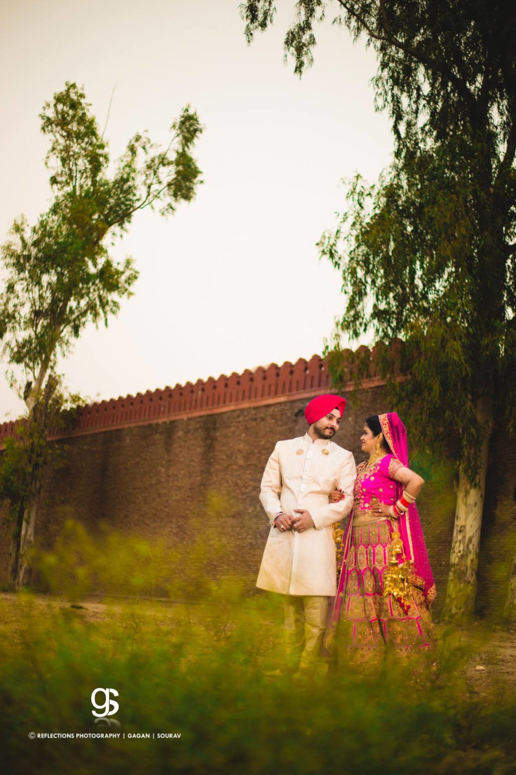 Bride and Groom Wearing Elegant Combination Outfits by Sourav Samanta Wedding-photography Groom-wear-and-accessories Wedding-dresses | Weddings Photos & Ideas