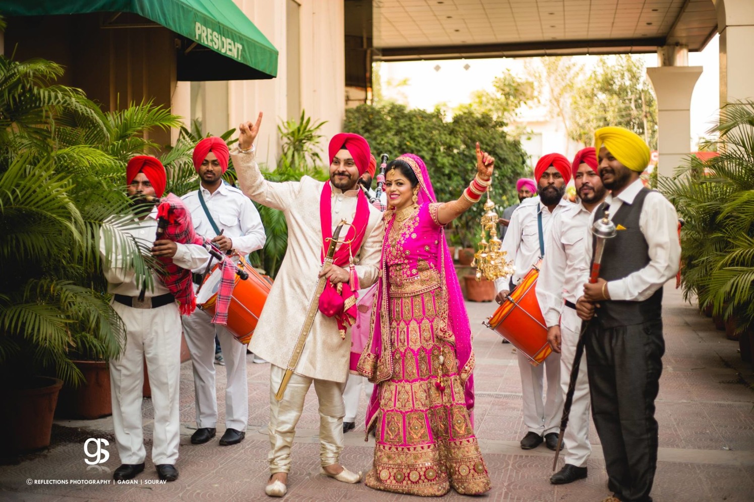 Candid Photo of the Bride and Groom Making a Dance Pose by Sourav Samanta Wedding-photography Groom-wear-and-accessories Wedding-dresses | Weddings Photos & Ideas