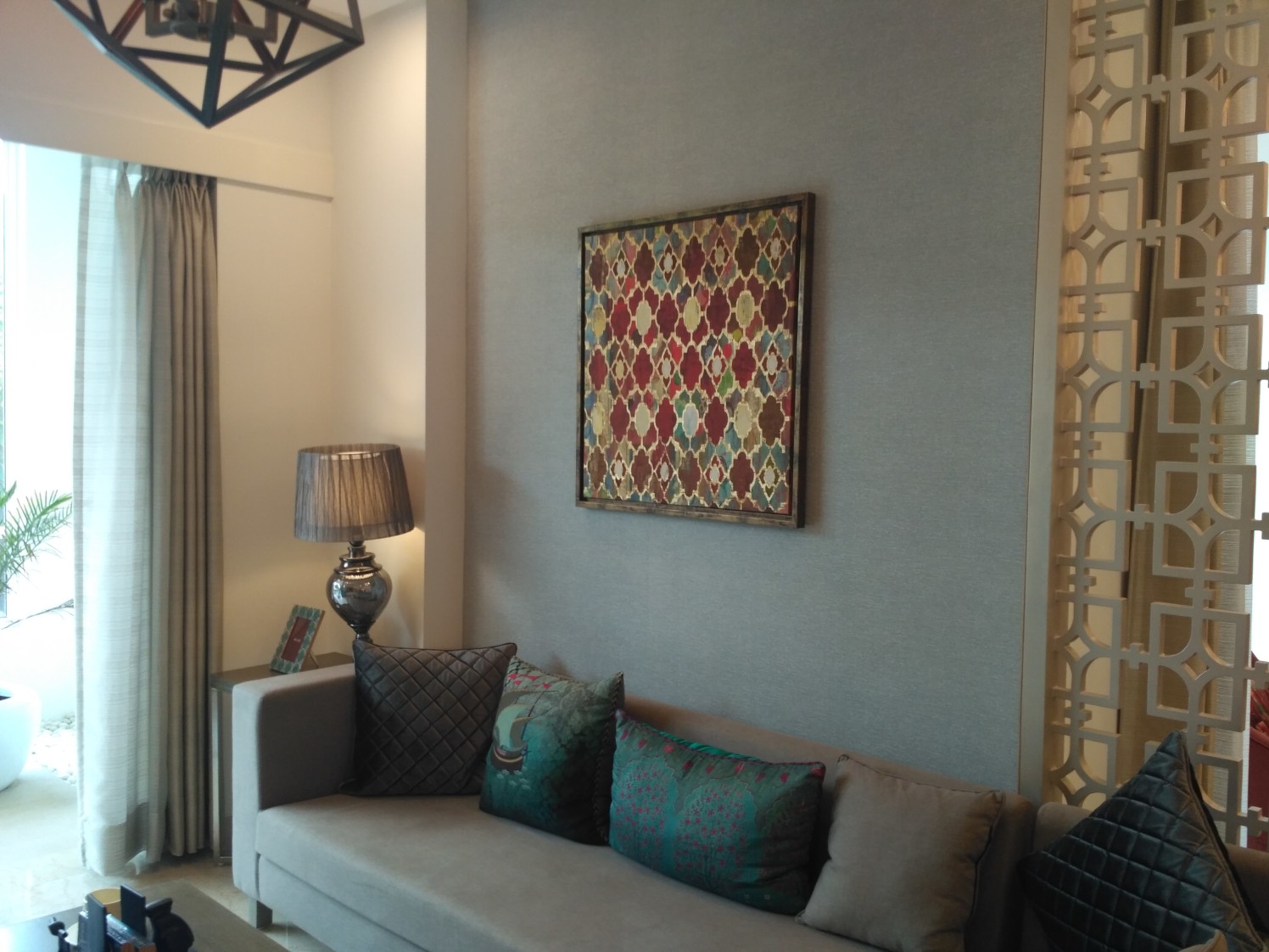 Living room area with sectional sofa and wall pattern by Navneet Kalra Living-room Contemporary | Interior Design Photos & Ideas