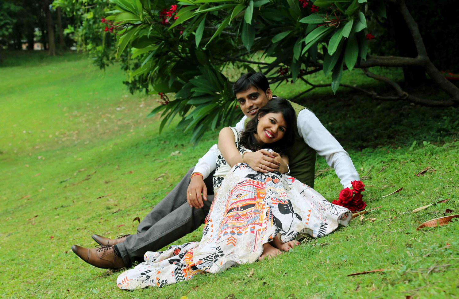 Candid Relaxed Pose of Bride and Groom To-Be in a Picturesque Garden Backdrop by Rushil Jadhav Wedding-photography | Weddings Photos & Ideas