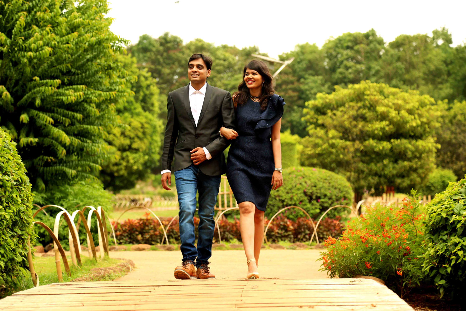 Candid Click of Bride and Groom To-Be Against Picturesque Garden Backdrop by Rushil Jadhav Wedding-photography | Weddings Photos & Ideas