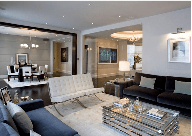Neutral Themed Living Room With Sectional Sofas by Designopedia Living-room Modern | Interior Design Photos & Ideas