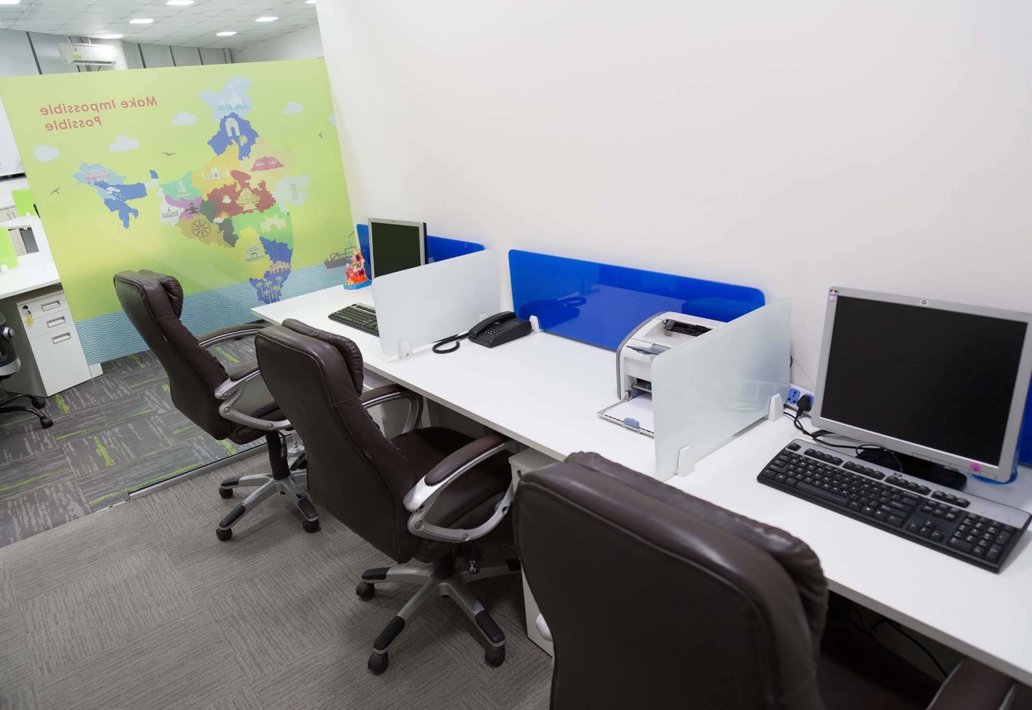 Basic Office Space with White Desk and Brown Chairs by Trupti Ladda Contemporary | Interior Design Photos & Ideas