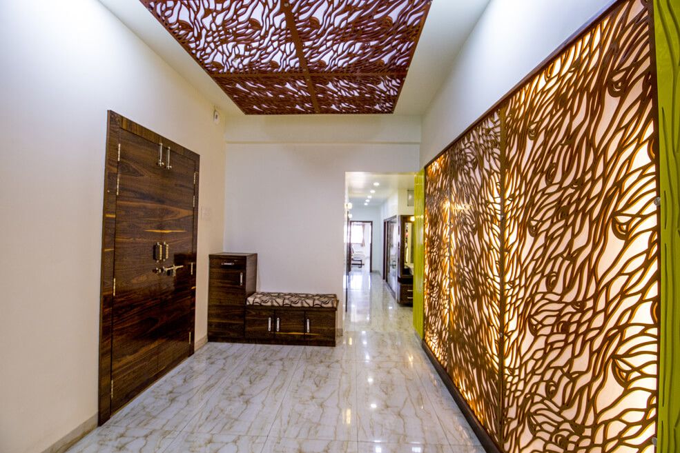 Walnut Brown Wooden Gate and Small Cabinets with Glossy Finish and Patterned Tiles Flooring by Trupti Ladda Indoor-spaces Contemporary | Interior Design Photos & Ideas