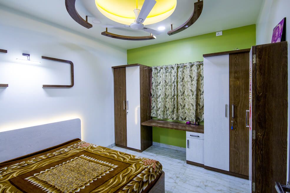 Master Bedroom with Edgy Designs and brown Colored Study Table and Wardrobe by Trupti Ladda Bedroom Contemporary | Interior Design Photos & Ideas