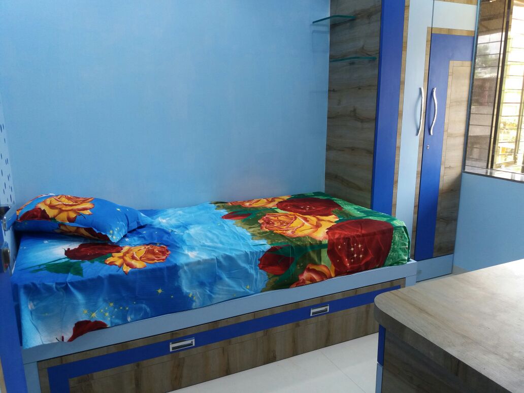 Single bed with wardrobe and blue wall by Nidhi Rathod Bedroom Contemporary | Interior Design Photos & Ideas