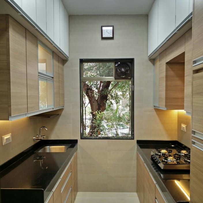 Small Parallel Kitchen With Wooden Cabinets by Mitul Shah ...