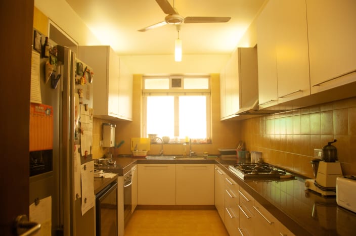 U Shaped Modular Kitchen With Breakfast Counter u shaped modular kitchen with white glossy cabinets and black counter top