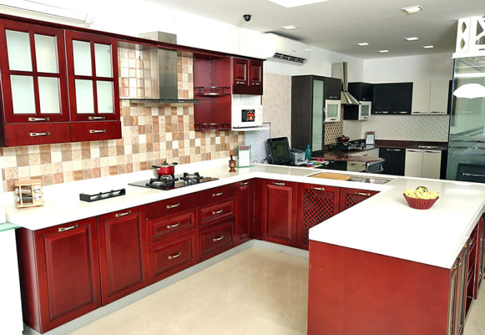 U shaped kitchen with false ceiling and maroon cabinets by 