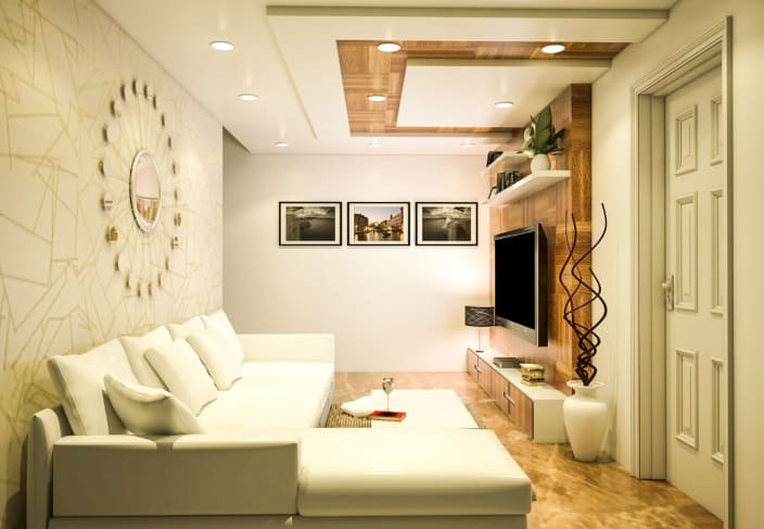 Compact Living Room Design With White L Shaped Sofa And False Ceiling Lit By Led Lights By Sakina Azher