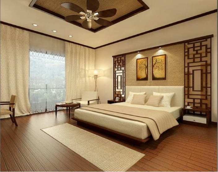 Warm Tone Bedroom With White Cushioned Bed And Wooden Vinyl Flooring By Ryan Associates