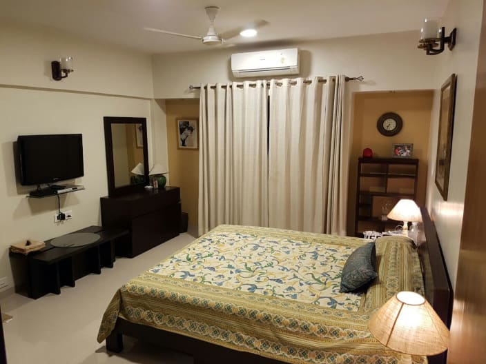 Bedroom With Tv Unit Dressing Table And Wall Decor By Global Associates