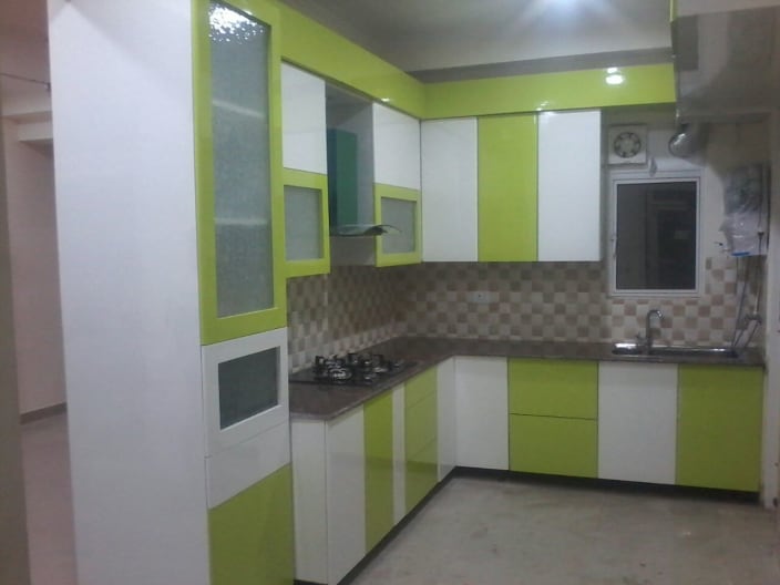 Closely Packed Modular Kitchen With Lime Green And White Colored Cabinets By Chauthi Interior Design