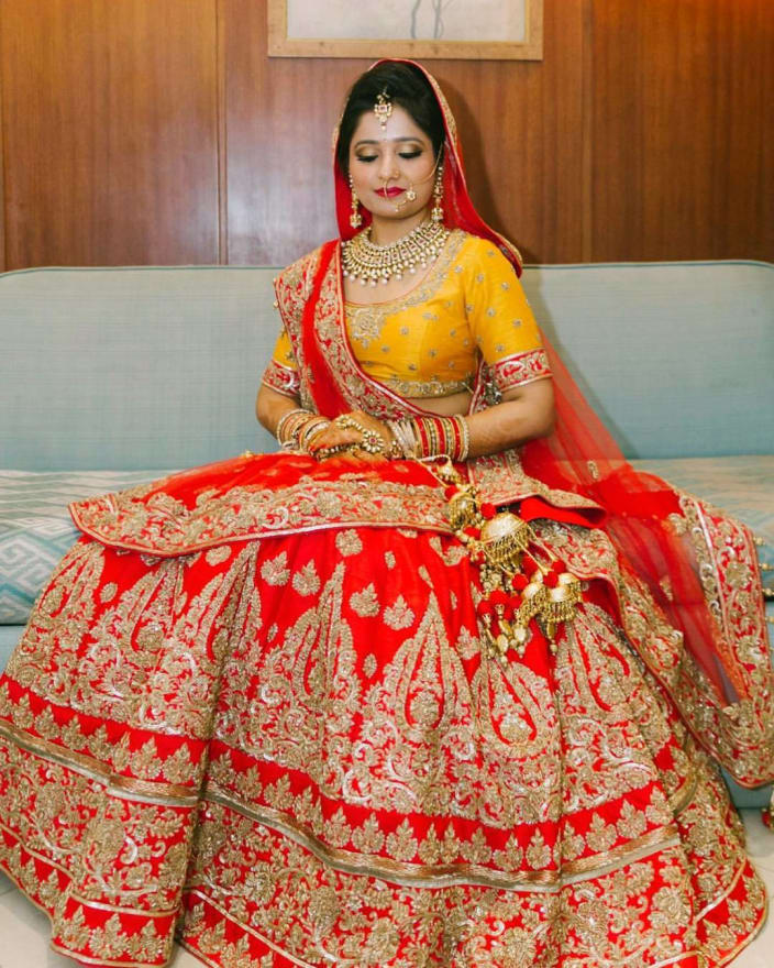 red and yellow bridal lehenga