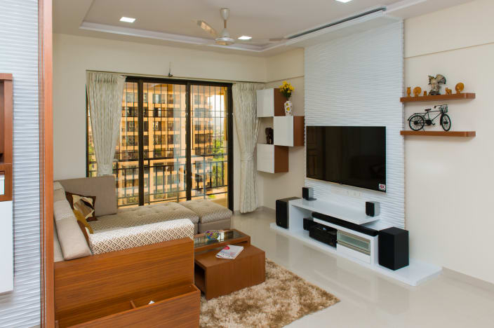 Sleek White Themed Living Room With Wooden Furniture And Credenza By Makemycasa