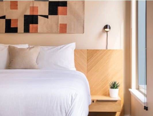 Modern light-filled bedroom at Urby - luxury apartments for rent