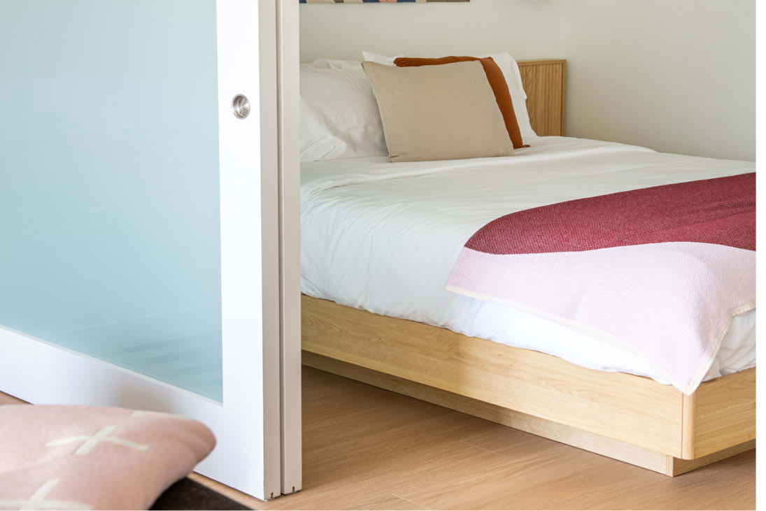 View of the designer bedroom at Dallas Urby - luxury Dallas Design District apartments for rent