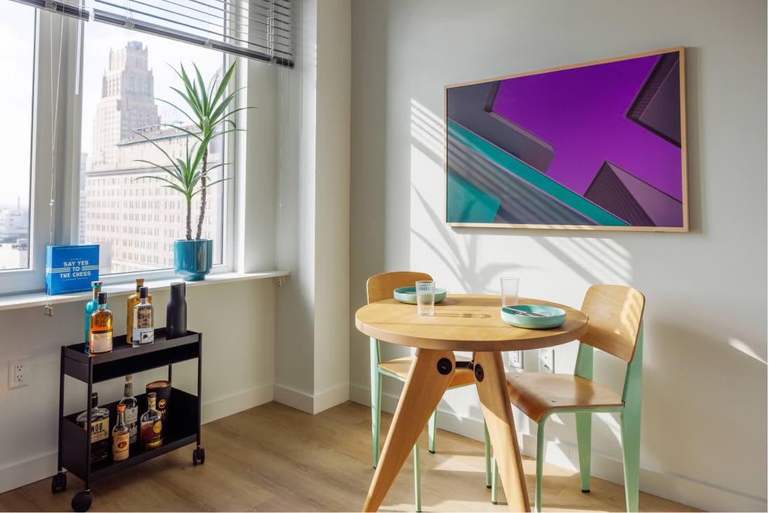 View of the designer living room details including oversized windows at Newark Urby - luxury Newark NJ apartments for rent