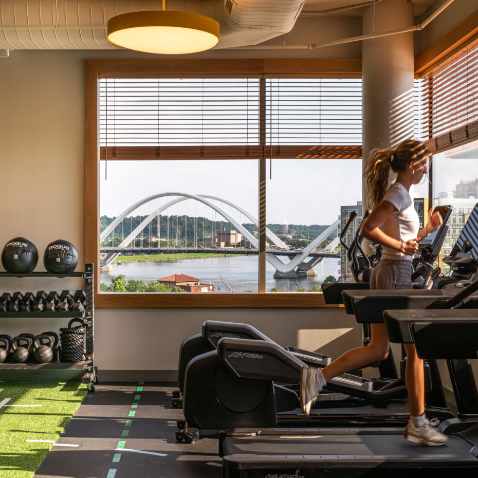 View of light-filled, state-of-the-art gym at Navy Yard Urby - luxury Navy Yard apartments for rent in Washington DC