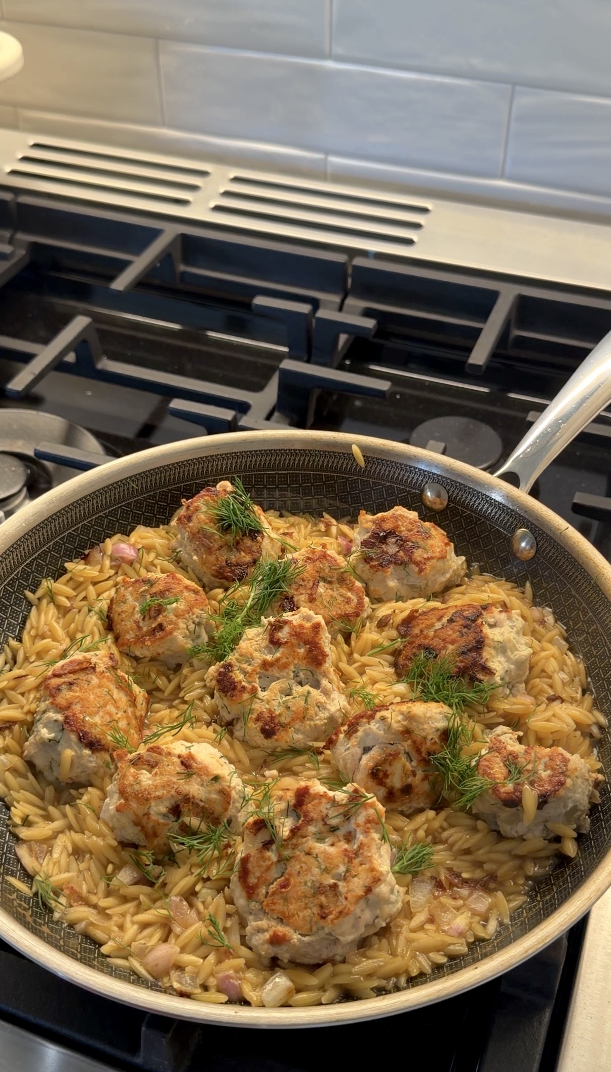lemon dill chicken meatballs served over creamy orzo with fresh dill and lemon zest