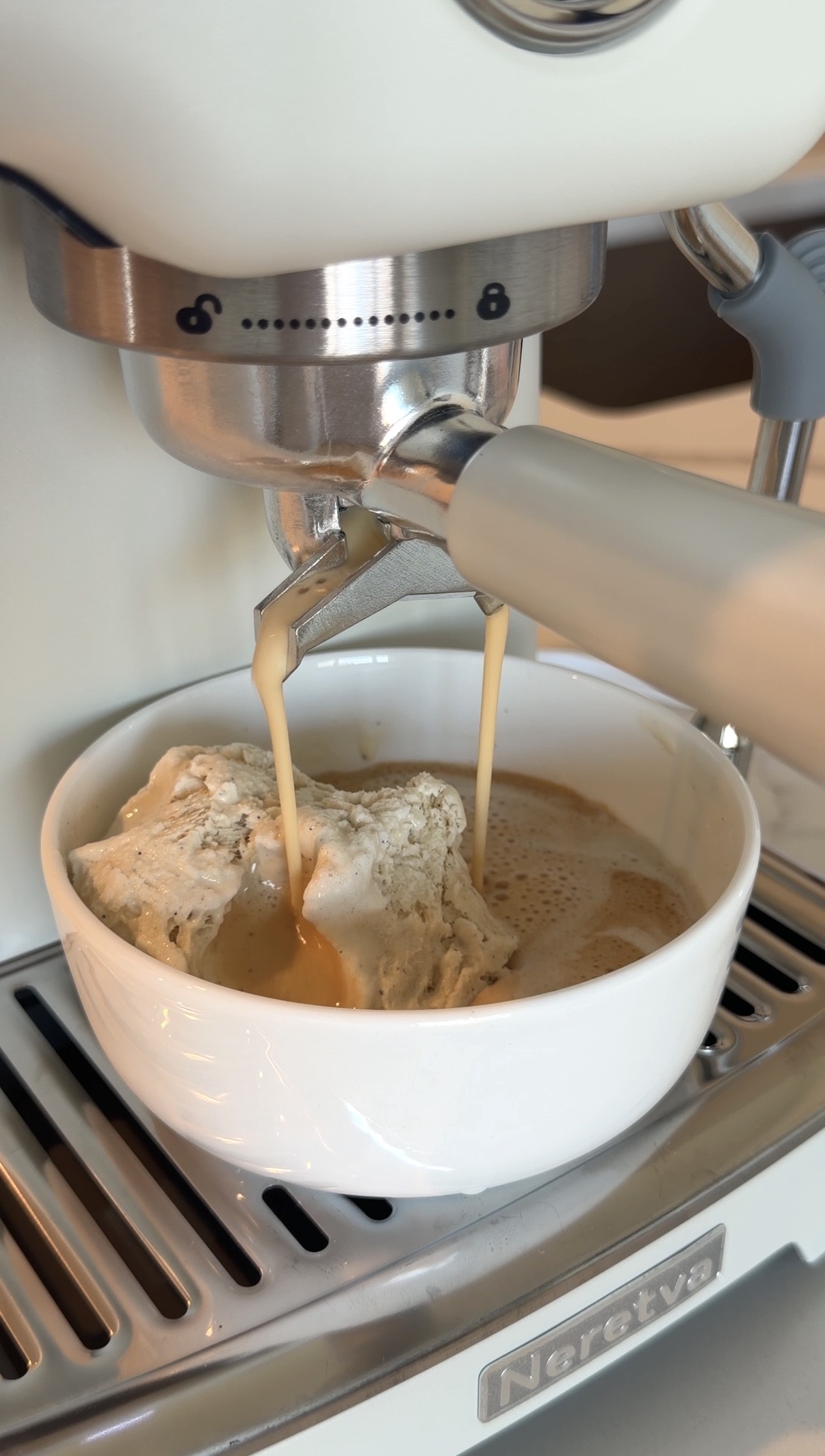 classic affogato with hot espresso poured over vanilla ice cream