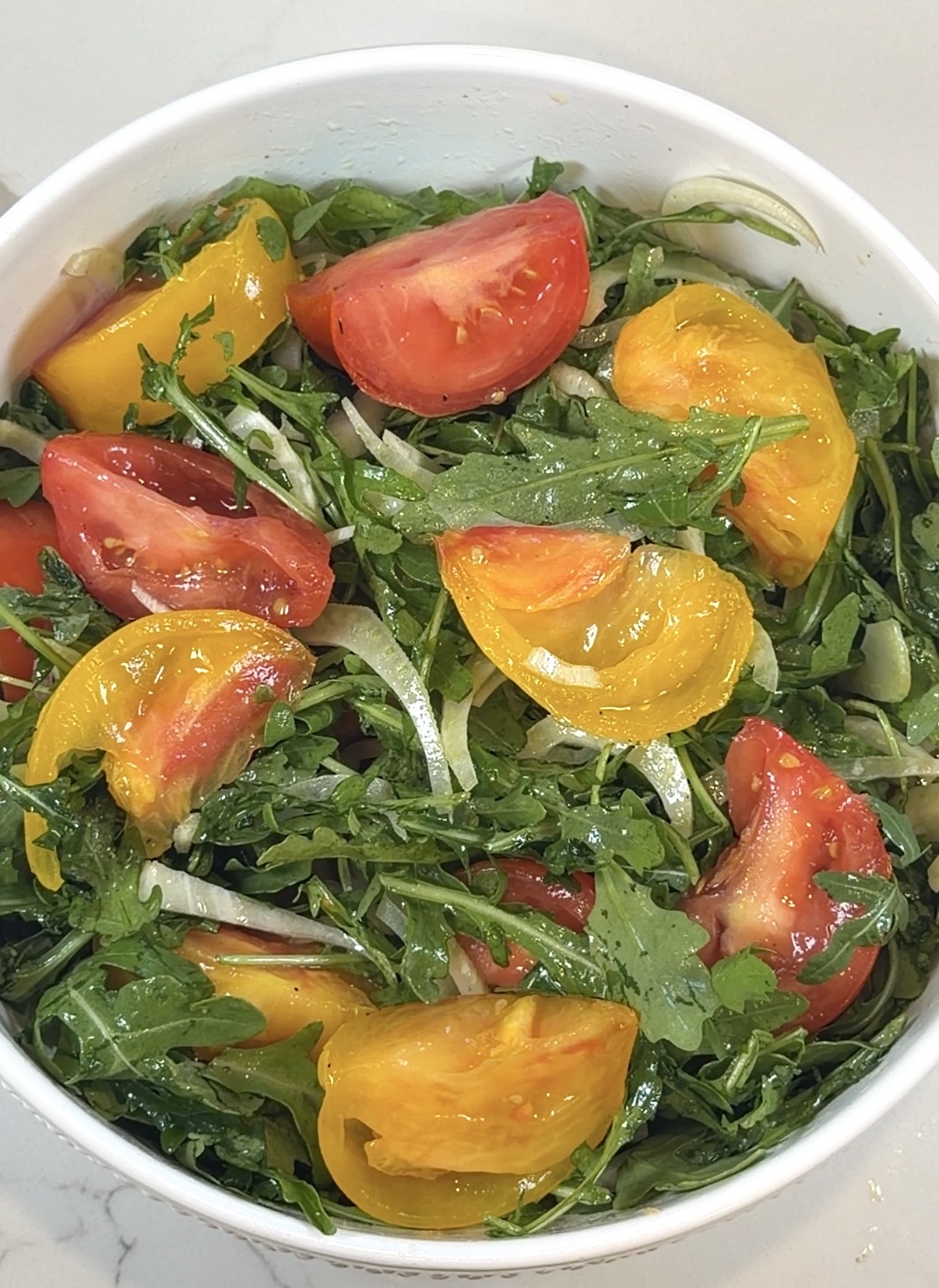 summer arugula salad with heirloom tomatoes, shaved fennel, and lemon vinaigrette