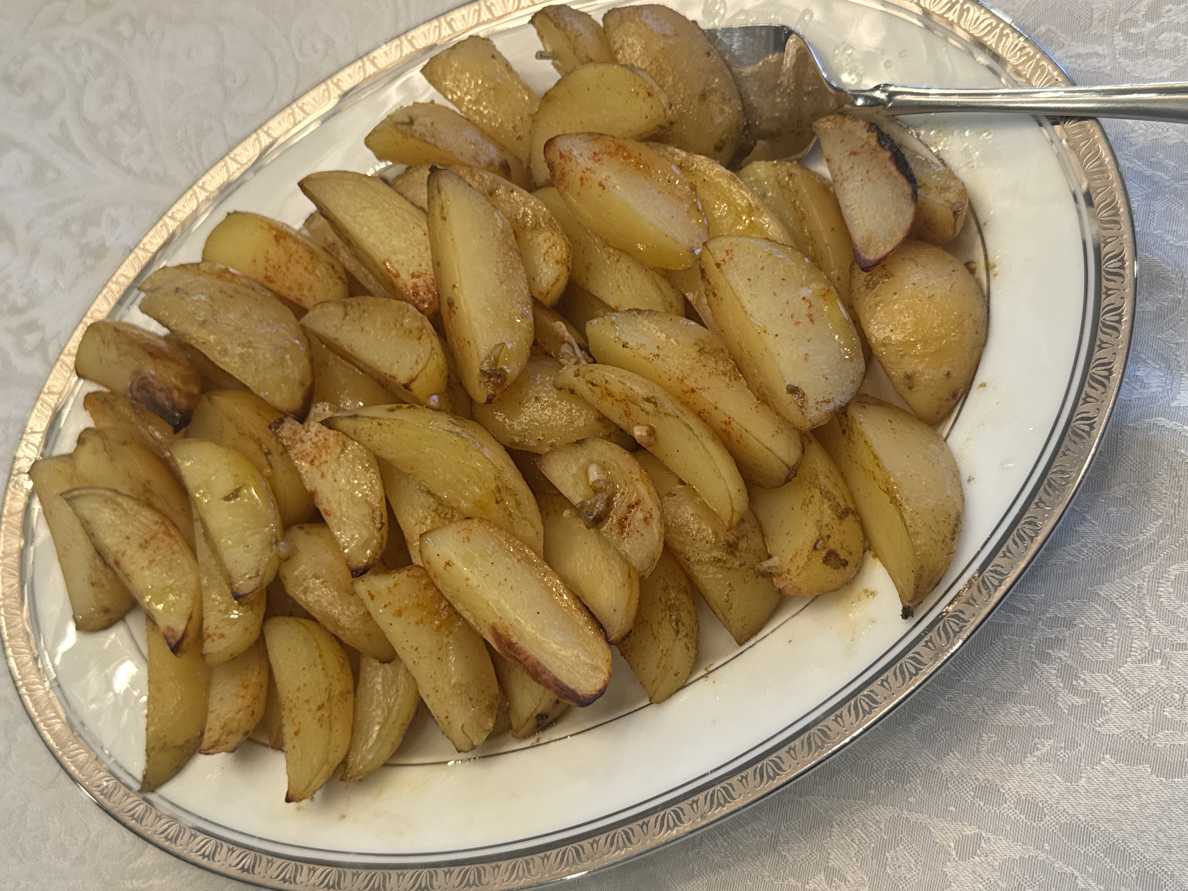 crispy Greek lemon potato wedges roasted with garlic, oregano, and paprika