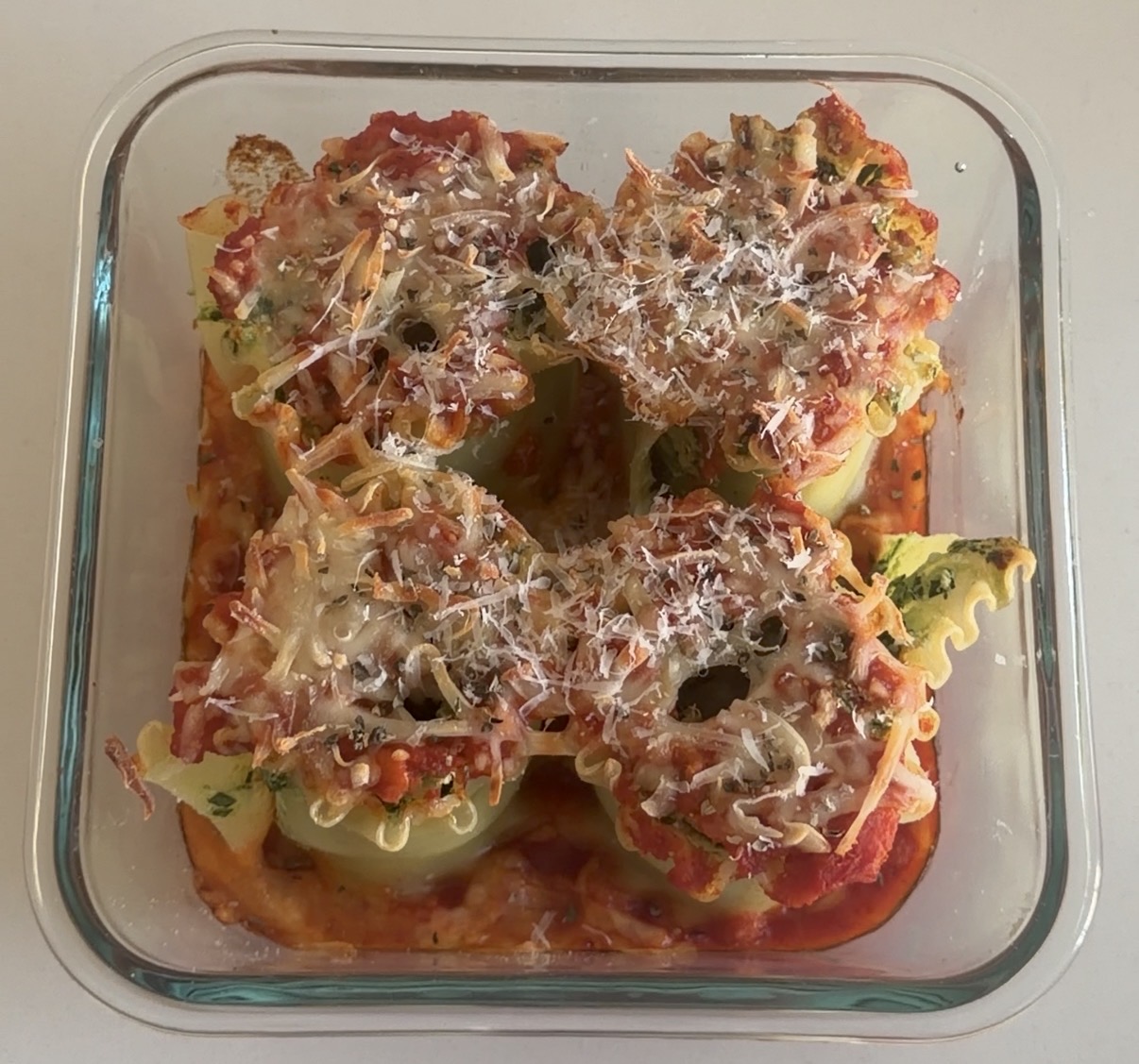 spinach and ricotta lasagna pinwheels baked with marinara and mozzarella