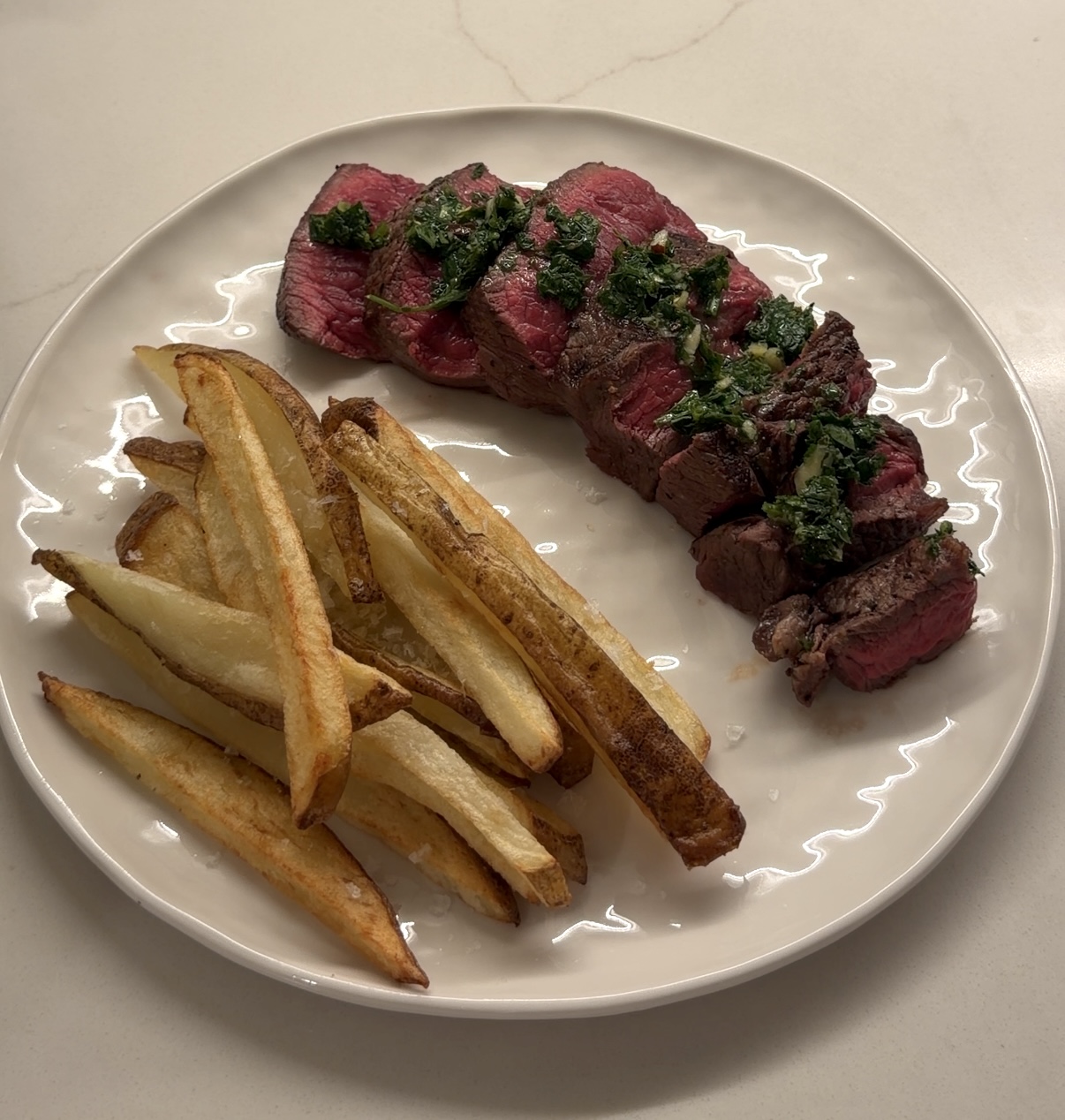 sirloin steak frites with crispy homemade fries and fresh chimichurri