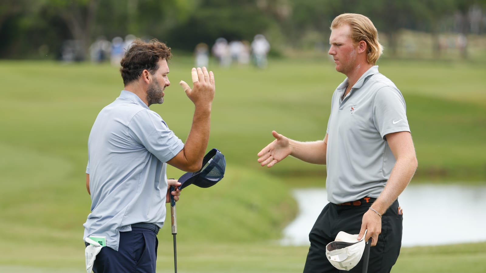 Ex-Cowboys quarterback Tony Romo (left) acquitted himself nicely in his first USGA championship round, carding a 4-under-par 67 with partner Tommy Morrison at Kiawah Island Club's Cassique. (USGA/Chris Keane)