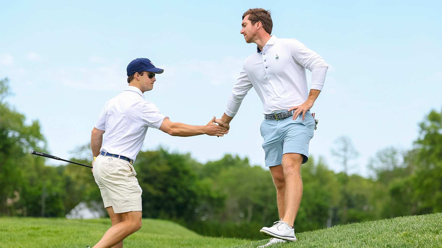 Jack Larkin Jr. (left) and Zach Healy had the comeback of the day, rallying from 2 down with two to play in a 20-hole victory in the Round of 32 at Plainfield Country Club. (USGA/Simon Bruty)