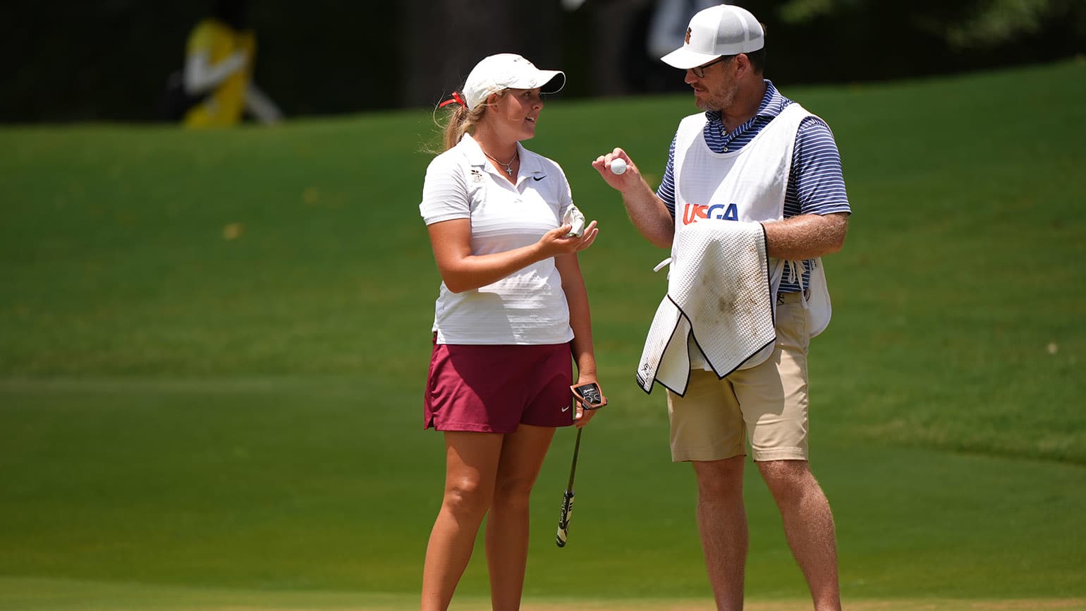 With Wake Forest assistant Ryan Potter (right) back on her bag for the 2026 U.S. Women's Open Presented by Ally, amateur Chloe Kovelesky has a trusted confidant inside the ropes . (USGA/Darren Carroll)