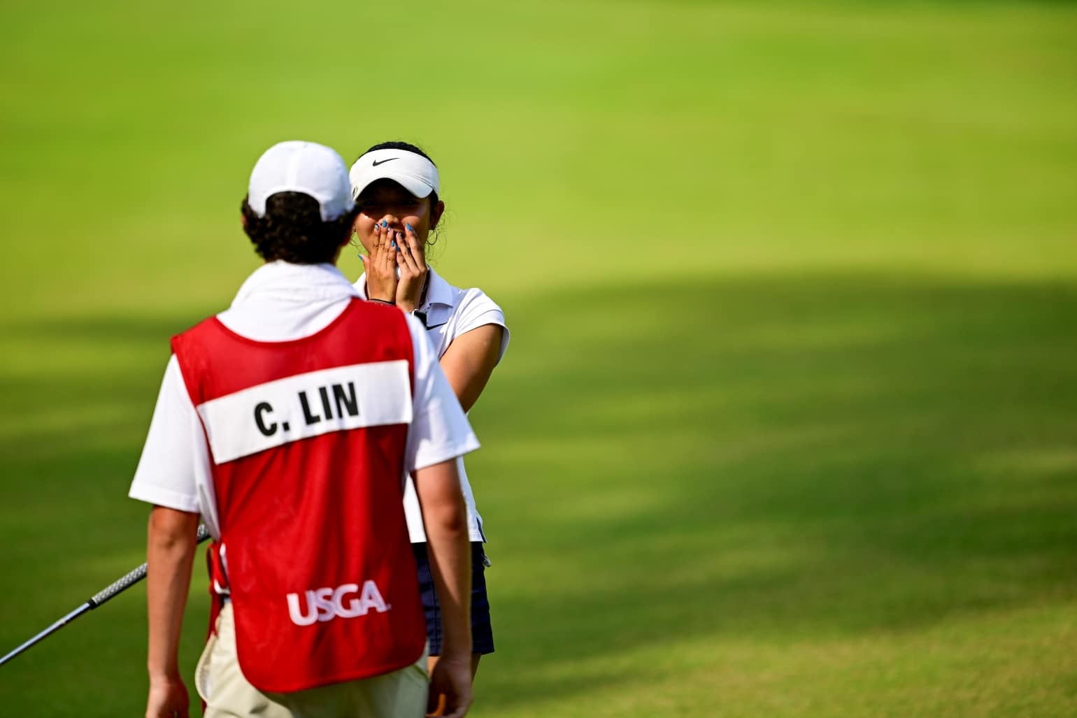 Clairey Lin reacts toward her caddie, Charlie Price, after she won the final match, 5 and 4, at the 77th U.S. Girls' Junior at Old Chatham Golf Club, in Durham, N.C. on Saturday, (Logan Whitton/USGA)