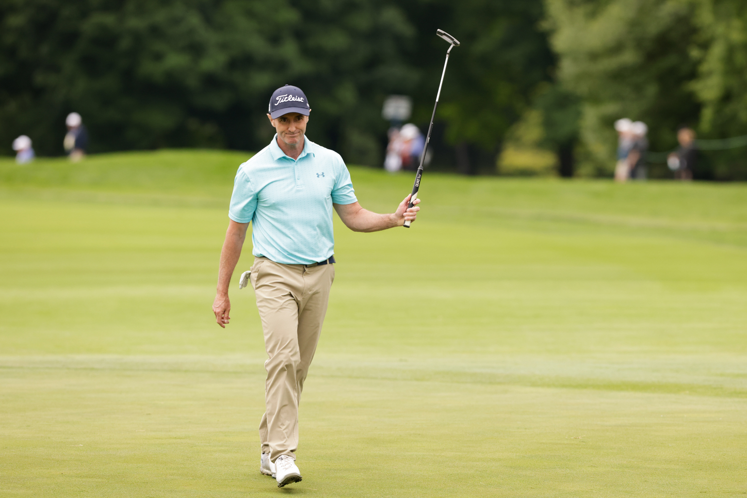 Haas Beats His Age, Shares Lead with Hensby