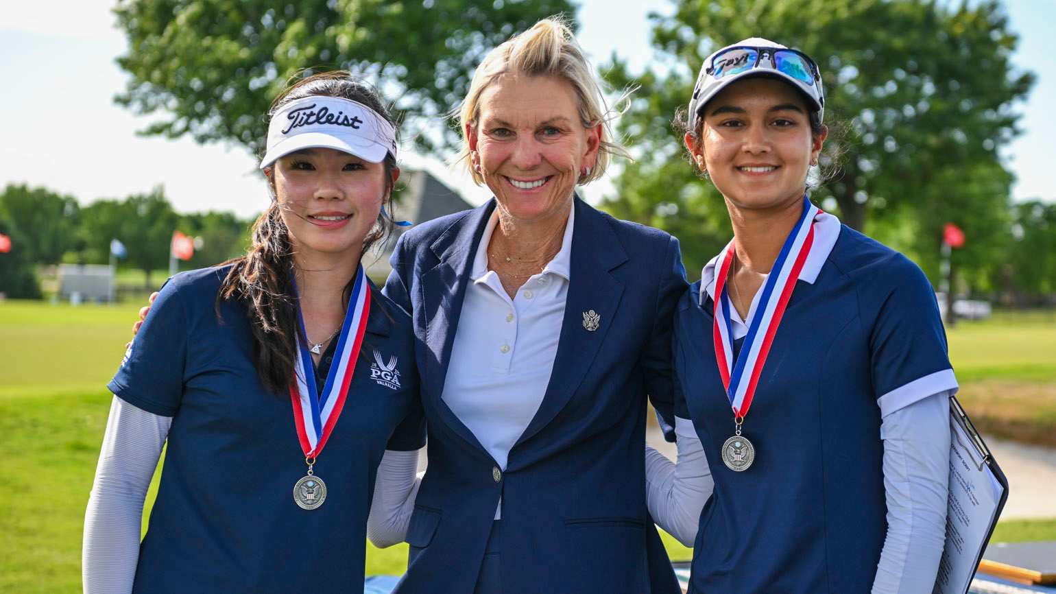 Keira Yun (left) and Athena Singh had a nice run to the championship match, and received silver medals from USGA Executive Committee member Leslie Henry on Wednesday at Oklahoma City Golf & Country Club. (USGA/Ted Pio Roda)