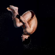 A photo of diver Brandon Loschiavo performing a dive in a tuck position