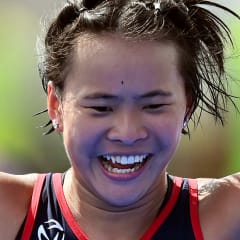 Emma Meyers of the USA celebrates as she crosses the finish line during the World Para Triathlon Series Swansea at on July 15, 2023 in Swansea, Wales.