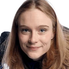 Corrine posing at a photoshoot