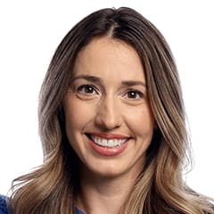 Deedra smiling to camera