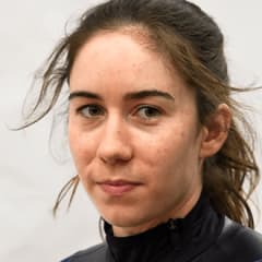 Julie in a race uniform smiling