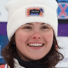 Kaila Kuhn poses on the podium.