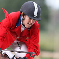 Laura Kraut and her horse leap into the air