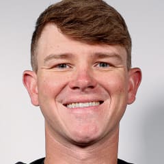 Christian Elliott poses for a portrait photo taken with USA Shooting.