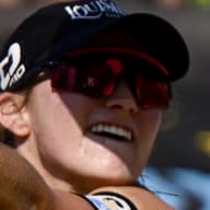 Kristen Nuss digs the volleyball against Terese Cannon and Sarah Sponcil during the AVP Gold Series Chicago Open at Pomellato’s Oak Street Boutique on September 03, 2022 in Chicago, Illinois.