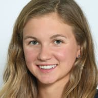 Headshot photo of Erika Acklerund wearing a navy blue shirt.