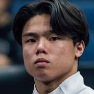 Asher Hong looking on.