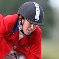Laura Kraut and her horse leap into the air